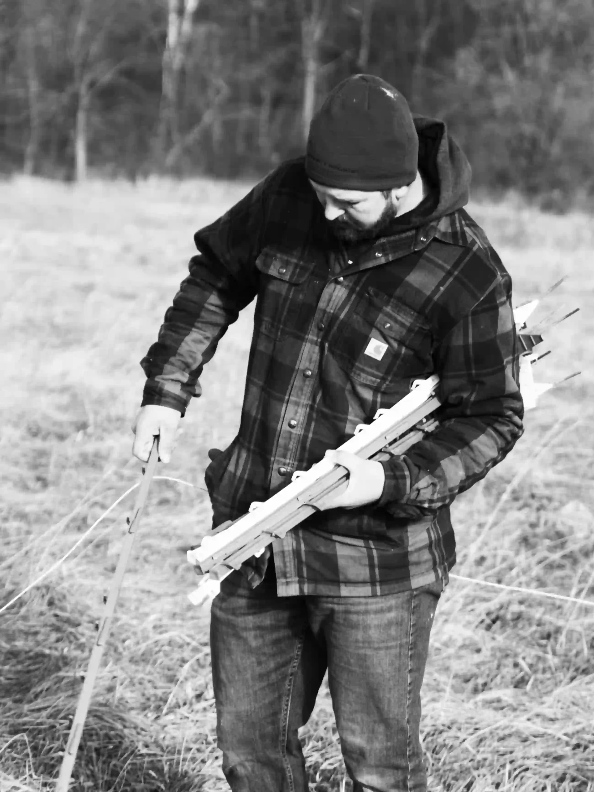 Teddy Placing Temporary Fence Post scaled Liberty Ridge Farm WI